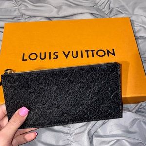 Authentic never used Louis Vuitton pouch